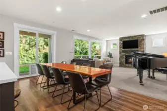 A floor to ceiling stone accent wall surrounds the gas fireplace for a beautiful focal point to the room.