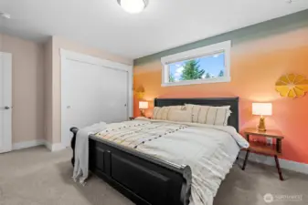 One of 3 guest bedrooms and featuring plush carpeting and several windows for a bright cheerful atmosphere.