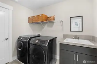 White GE Washer & Dryer top loaders will convey with the home. The washer and dryer pictured in this photo is for illustrative purposes only.