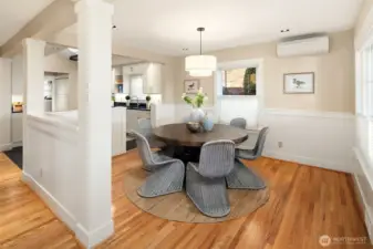 Dining area with beautiful millwork and hardwood floors in excellent condition.