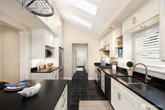 Looking west to the door to the garage. Single level access from garage to main floor.