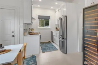 Updated kitchen includes space for an extensive wine collection...