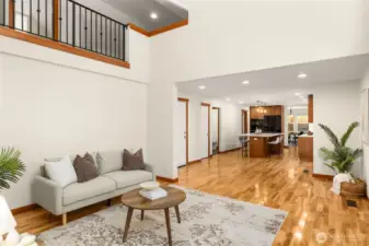 This expansive great room delivers a true sense of space with soaring ceilings and an abundance of natural light