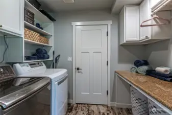 Laundry with folding table and storage