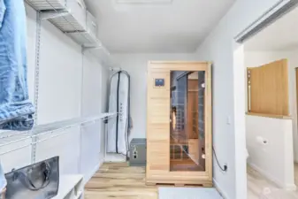 Walk in closet off of primary bedroom features a sauna.