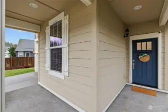 Room for a porch swing and warm inviting entrance!