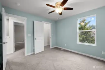 Bedroom #3 with a Walk-in Closet and Ceiling Fan.