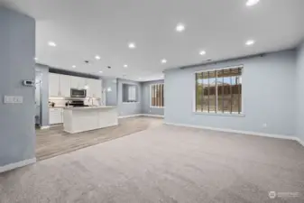 Open to the Foyer is this Wonderful Open Concept Living Space! New Carpet and Waterproof Manufactured Hardwood Flooring.