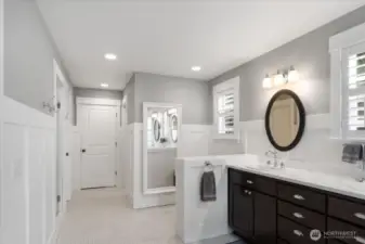 Primary Bath also features large double head shower with bench.