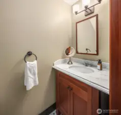 Main level half bathroom.