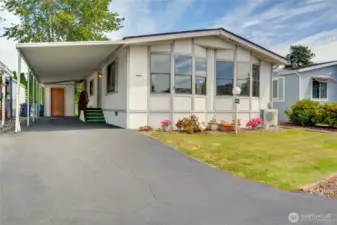 Welcome home! Expansive driveway with storage shed!