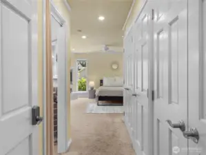 Wall of closets as you enter the primary