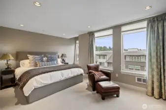 Spacious primary suite with fireplace.