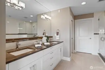5 piece primary bath with marble counters and heated floors.