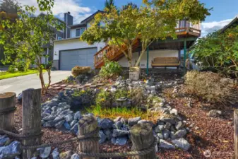 Front yard with pond and bench