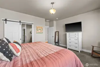 Barn door to en suite. Primary separate from other bedrooms