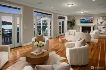 Positioned along a rare wide shoreline where views unfold across the living spaces.