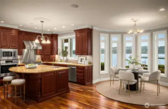 Breakfast area wrapped in windows overlooking Lake Washington.