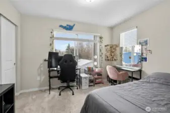 Spacious 3rd floor bedroom with versatile layout, ideal as a home office or guest room