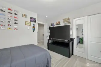 Sun-filled 3rd floor bedroom with large windows and a peaceful, retreat-like atmosphere