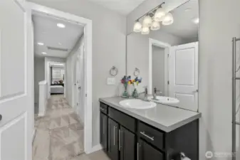3rd floor hallway full bathroom featuring clean tilework, updated fixtures, and generous counter space