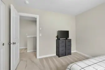Bright 3rd floor bedroom with elegant finishes, walk-in closet, and serene natural light