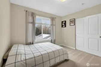 Refined 3rd floor bedroom with stylish accents, ample space, and a calm, welcoming ambiance