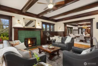 Intimate yet expansive, the main living area showcases built-in seating, artisan woodwork, and period lighting, flowing effortlessly into the formal dining room—an ideal setting for gatherings that feel both refined and warmly personal.