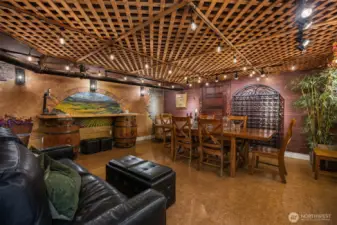 A hidden speakeasy-inspired lower level sets the stage for unforgettable evenings. Warm wood tones, lattice ceiling detail, ambient lighting, and a cozy fireplace create an intimate wine-tasting and entertaining space unlike anything else in downtown Snohomish.