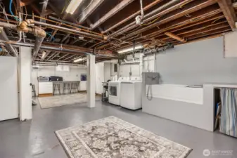 A remarkably large utility room provides exceptional functionality, featuring laundry, storage, workspace, and a dedicated pet wash station—perfect for modern living without sacrificing style or space.