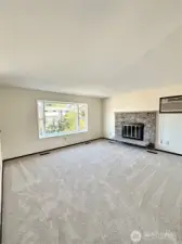 Wood burning fireplace in main floor living room