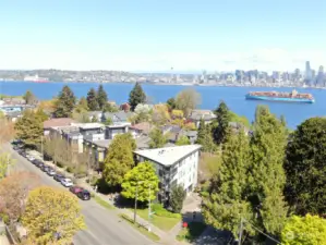 Ideally located in the heart of the North Admiral District of West Seattle.  Great views from triangular building's top floor of Seattle city skyline and Elliott Bay as well as a peek view of the Olympic Mountains from westerly kitchen window.