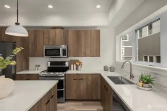 Kitchen features a quartz island, stainless steel appliances, and modern cabinetry.