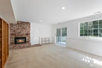 Huge family room featuring charming brick surround and patio entrance
