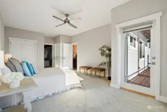 The 2nd bedroom on the lower level has private deck access and views of the Olympics. With so much light streaming in it is hard to believe this bedroom is in the lower level of the home.