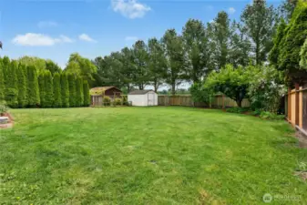 Fenced garden space and tool shed. Back gate access to Skagit River Park