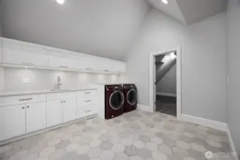 Massive laundry room upstairs with plenty of storage. Another identical laundry room on the main.