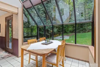 Large wall of windows in the nook off the kitchen offers an amazing view of the surrounding property