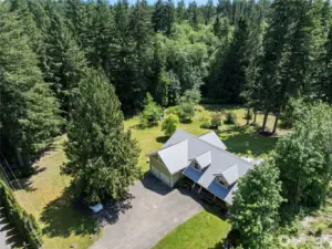Welcome to 3779 NE Wagon Wheel Lane. A beautiful peaceful retreat with over 2 acres of incredible privacy.