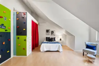 Guest room 1 comes equipped with a Seahawks rock wall that leads to a hidden loft area. What fun!