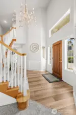 Light-filled interiors featuring high ceilings, oversized windows, and gorgeous chandelier.