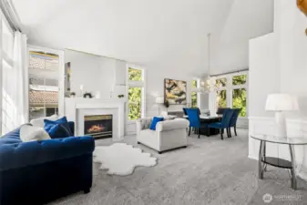 Cathedral ceilings and open-concept living space with a fireplace give this house a sense of grandeur bar none.