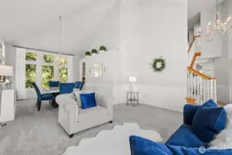Open Concept Living & Dining - immaculately maintained open-concept living and dining space with designer touches throughout. Enjoy crisp white walls, statement lighting, and garden views from nearly every angle—ideal for gatherings or quiet evenings at home.