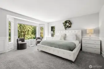 Elegant Primary Suite with Bay Window. Retreat to this luxurious primary bedroom featuring a plush carpet, and a stunning bay window nook with peaceful greenbelt views—perfect for reading or morning coffee.