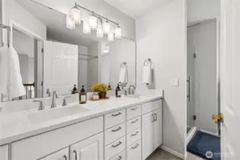 Updated Bathroom with Dual Vanities - Crisp and modern full bathroom featuring double sinks, sleek quartz counters, updated fixtures, and a walk-in glass shower. A perfect blend of functionality and style for shared or guest use.
