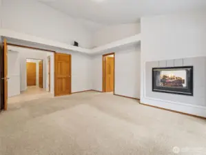 Primary Bedroom (on Main) w/ Deck Access, 5-piece en-suite, walk-in closet & fireplace