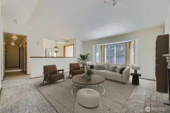 ATTRACTIVE LIVING ROOM, WITH VAULTED CEILINGS AND FIREPLACE.