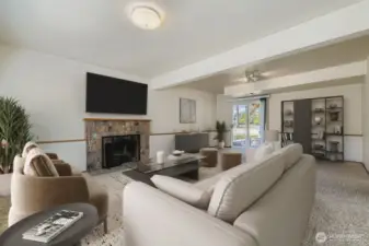 RELAXING FAMILY ROOM WITH FIREPLACE AND ROOM FOR FURNITURE.