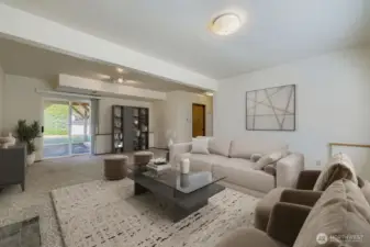 ENJOYABLE FAMILY ROOM ADJACENT HALF BATHROOM AND UTILITY ROOM.