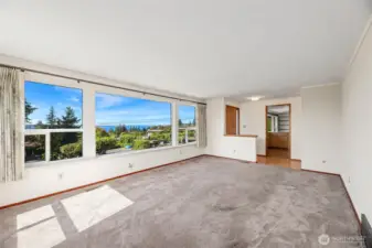 19' x 13' LIVING ROOM  Wall of windows with views of Olympic Mountains, Maury Island and Puget Sound